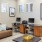 a room with a couch and a desk with a computer