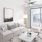 a living room with a white couch and a white chair