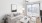 a living room with a white couch and a white chair