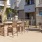 outdoor patio space with grils, tables, and chairs