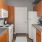 a kitchen with wooden cabinets